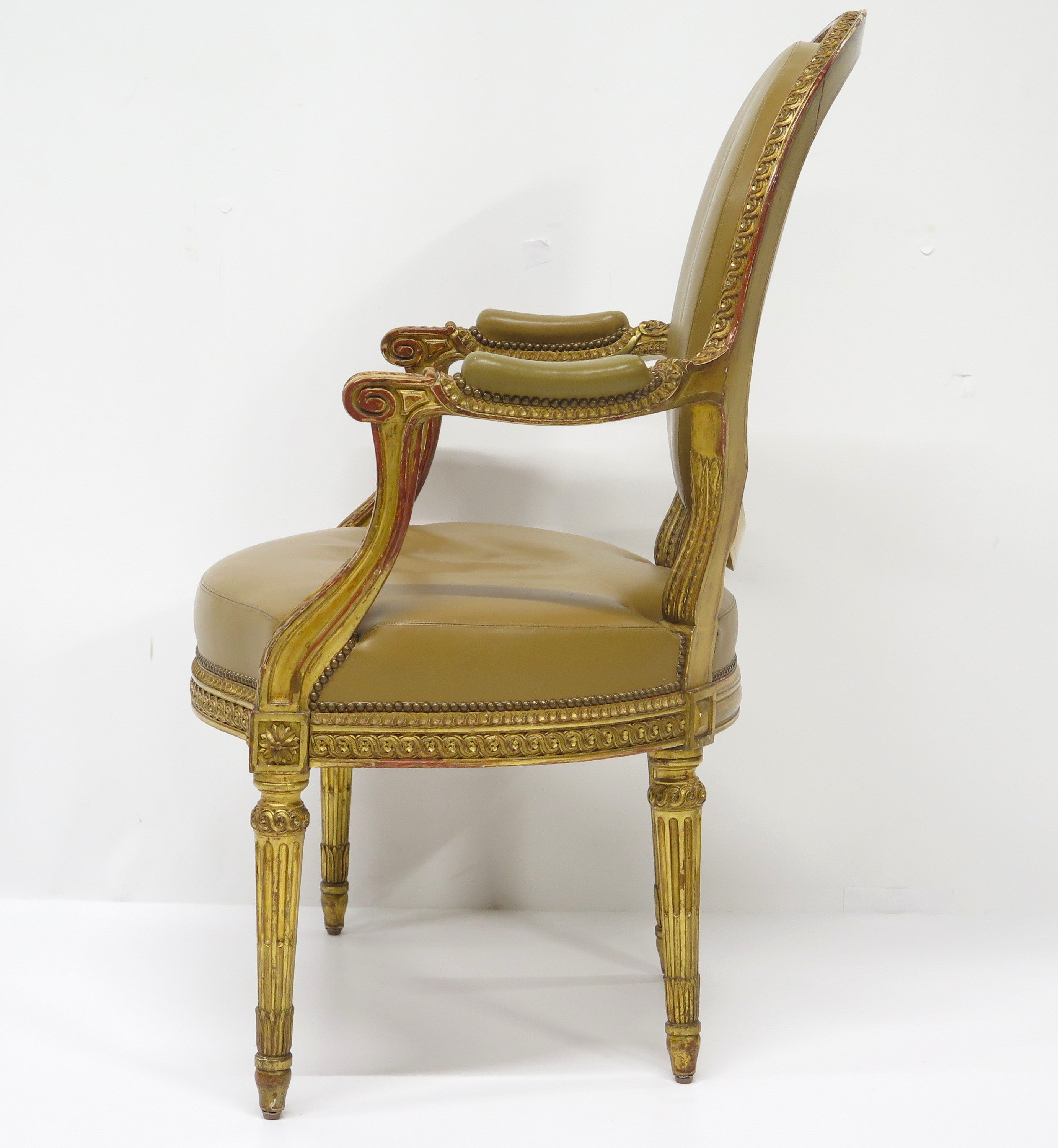 Louis XVI-Style Carved and Gilded Leather Fauteuil