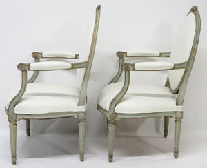 A Pair of 18th Century Paint and Parcel Gilt Italian Arm Chairs