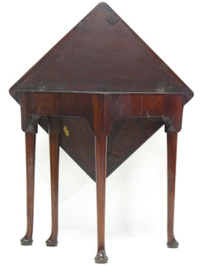 A George III mahogany drop leaf corner table