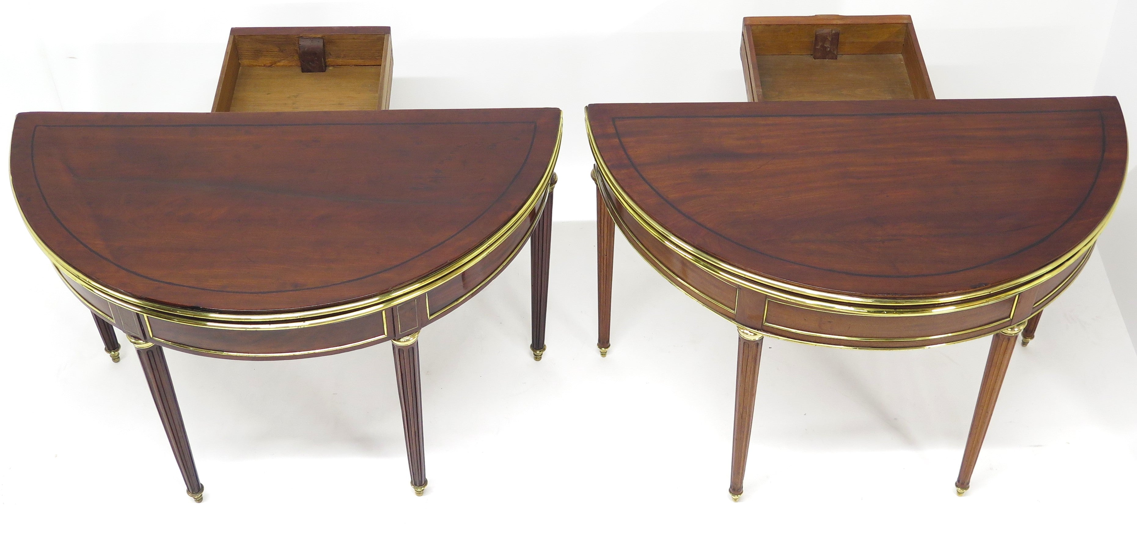 A Beatiful "Near" Pair of Louis XVI Style Mahogany and Brass Mounted Demilune Games Tables