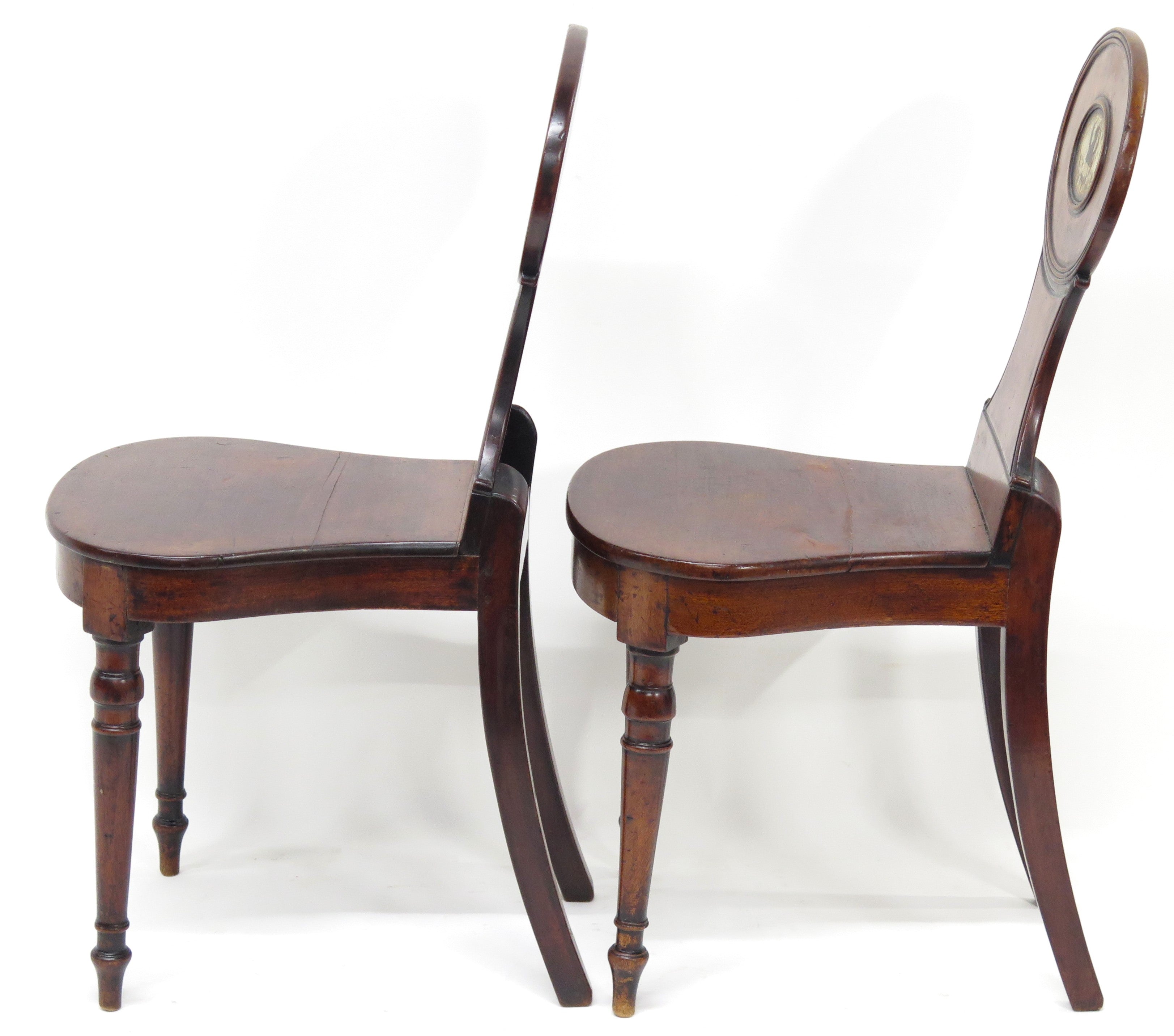 A Pair of English Regency Mahogany Hall Chairs