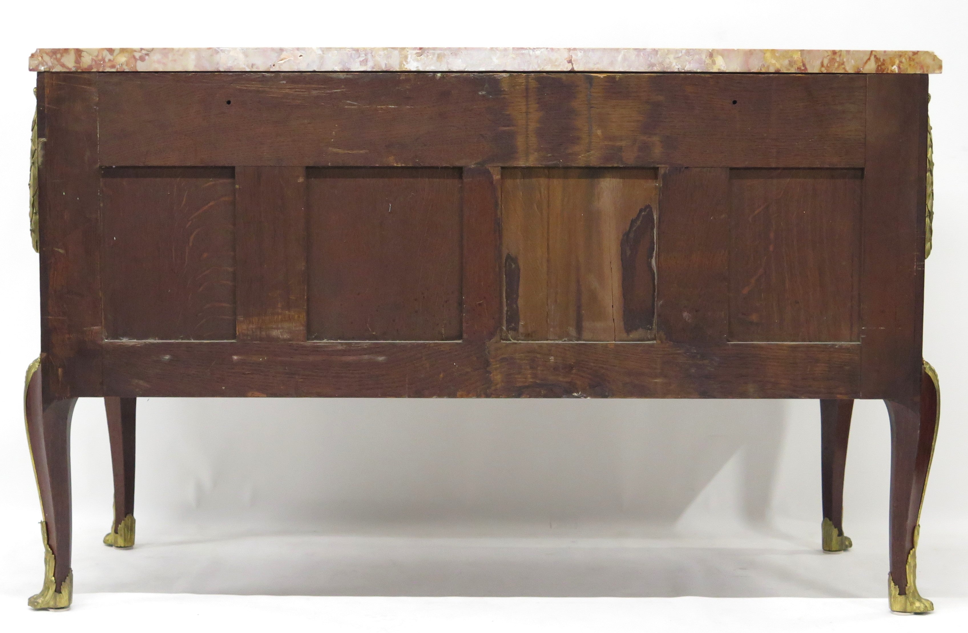 A French Ormolu-mounted Amaranth, Kingwood, Bois Satine, and Burr-amboyna Commode