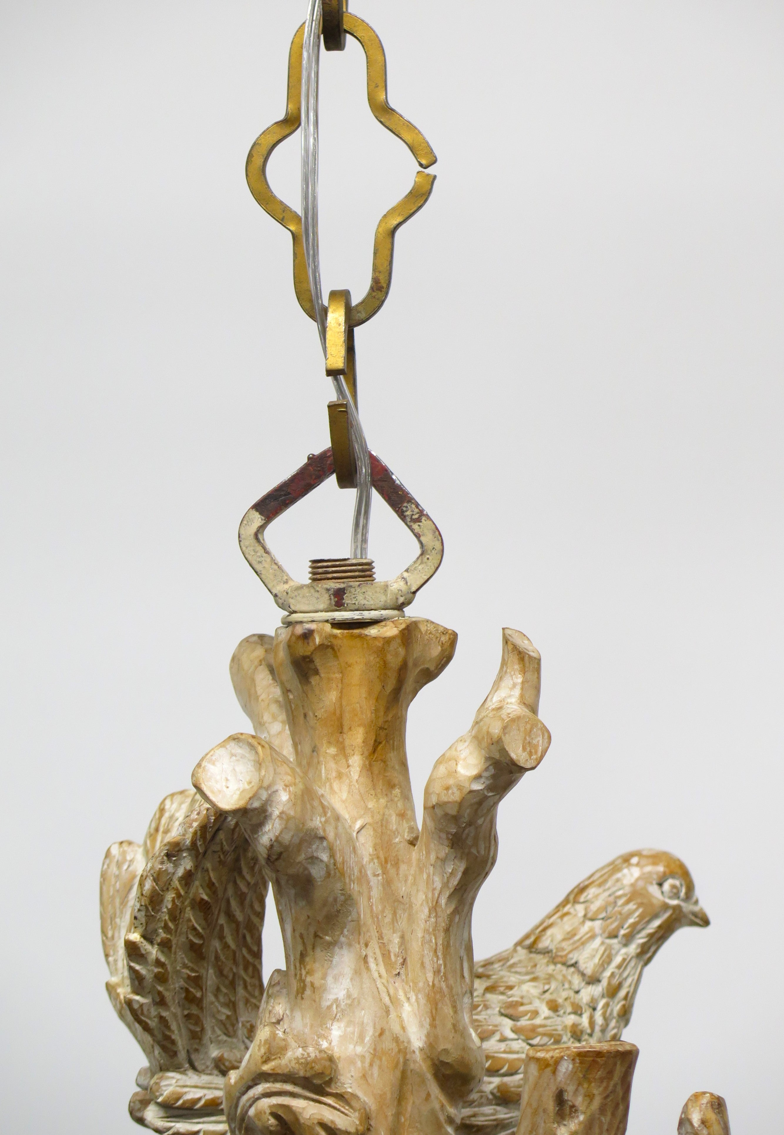 A Carved Italian Faux Bois Pickled Ten Light Chandelier