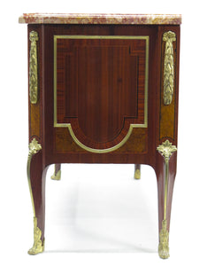 A French Ormolu-mounted Amaranth, Kingwood, Bois Satine, and Burr-amboyna Commode