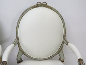A Pair of 18th Century Paint and Parcel Gilt Italian Arm Chairs