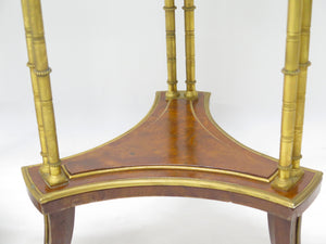 A pair of elegant Louis XVI-style gilt bronze gueridons