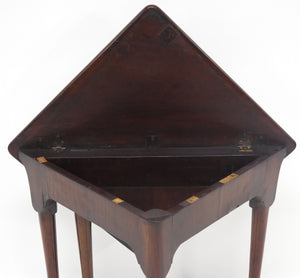 A George III mahogany drop leaf corner table