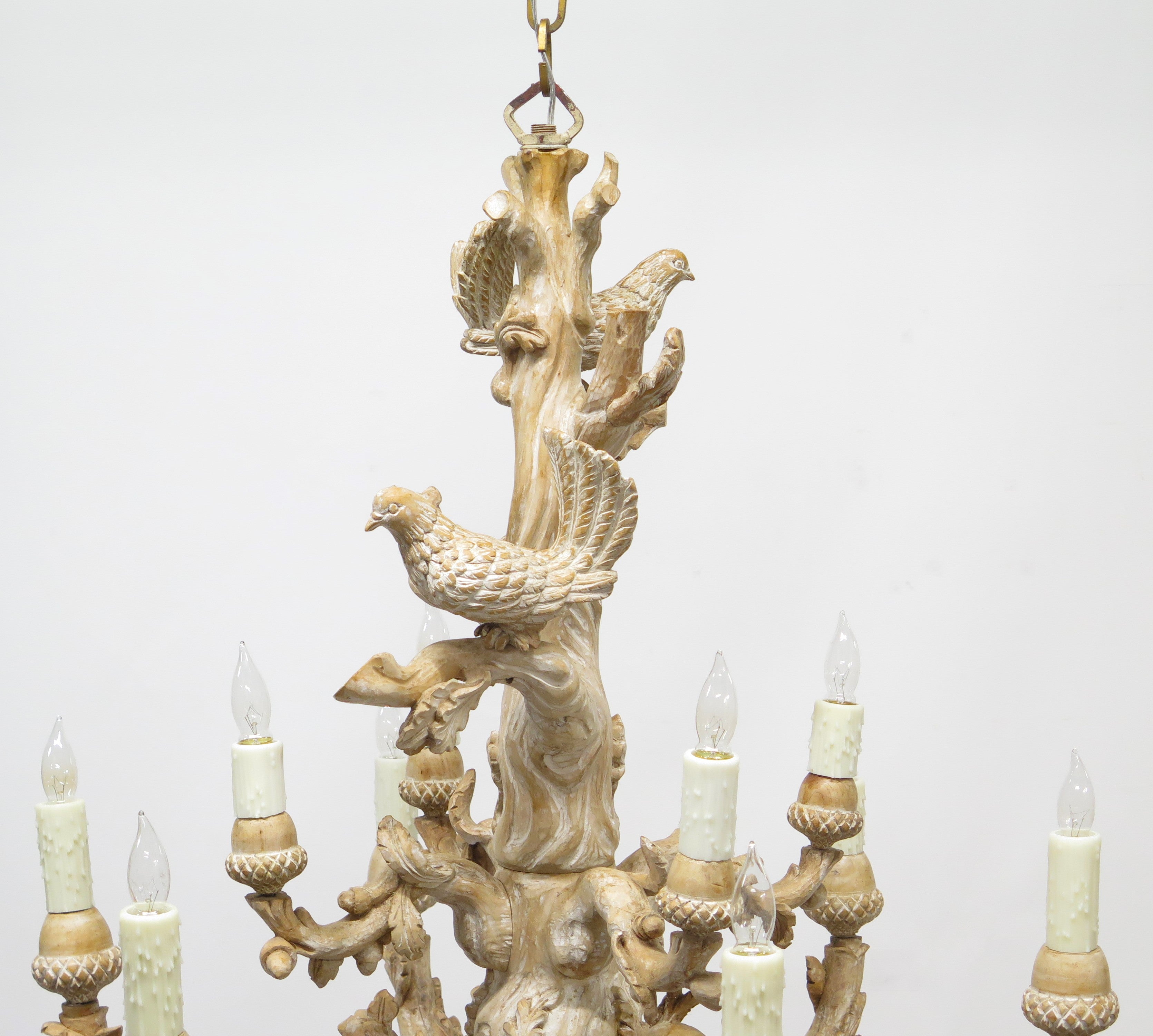 A Carved Italian Faux Bois Pickled Ten Light Chandelier