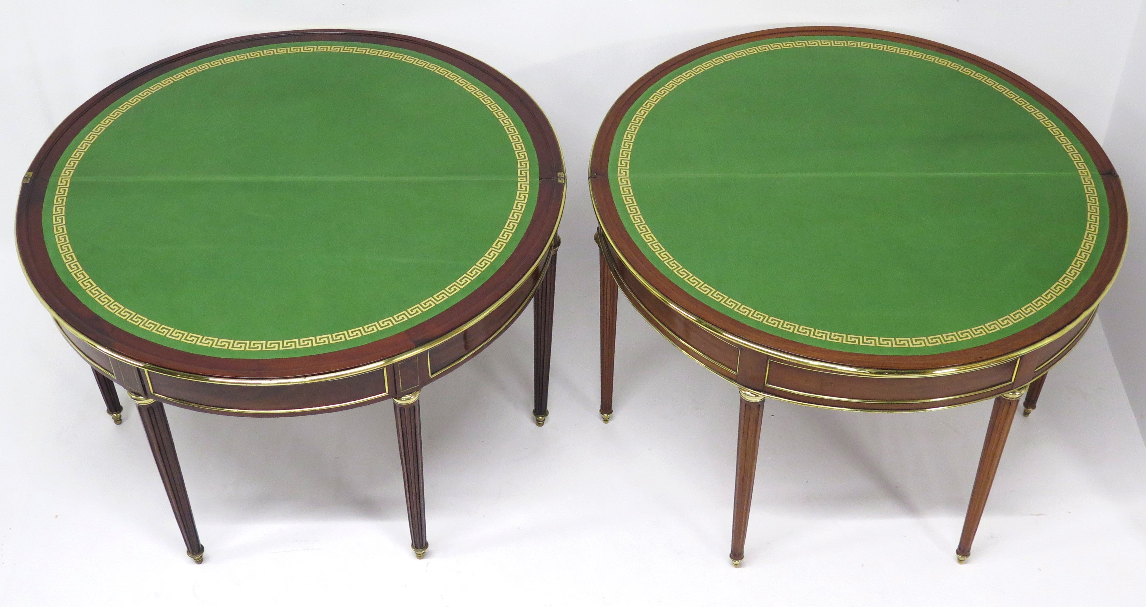 A Beatiful "Near" Pair of Louis XVI Style Mahogany and Brass Mounted Demilune Games Tables