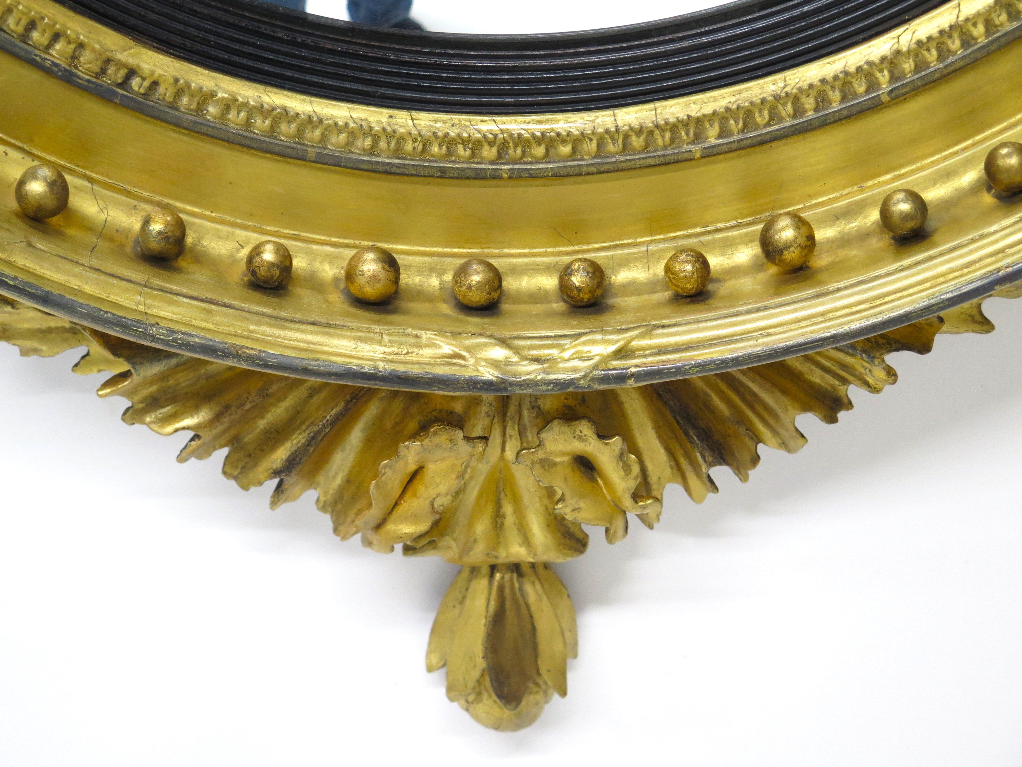 A Large English Regency Gilt Wood Convex Mirror