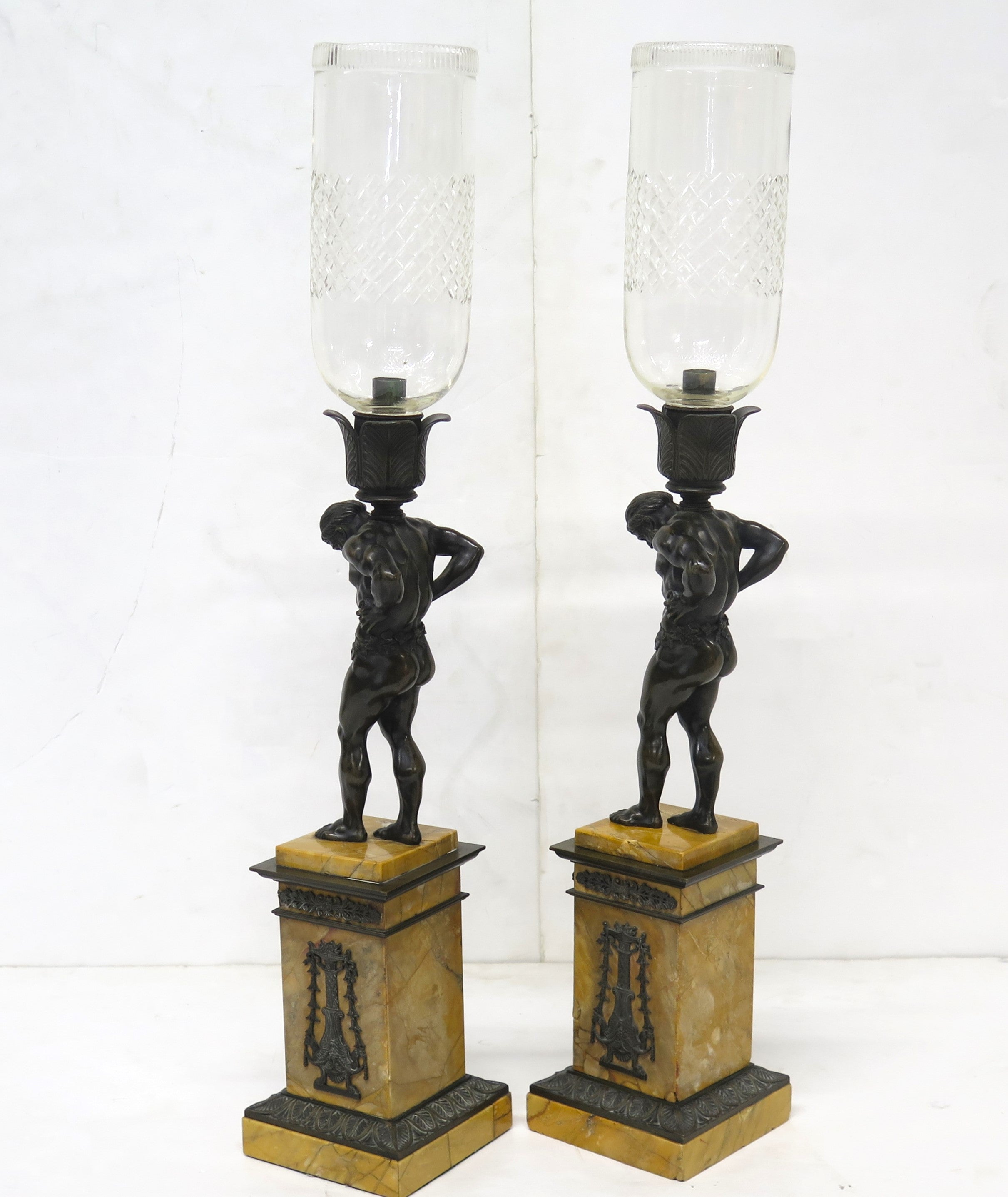 Pair of French Restoration Period Candlesticks of Patinated Bronze and Gilt Bronze with Figures of Atlas