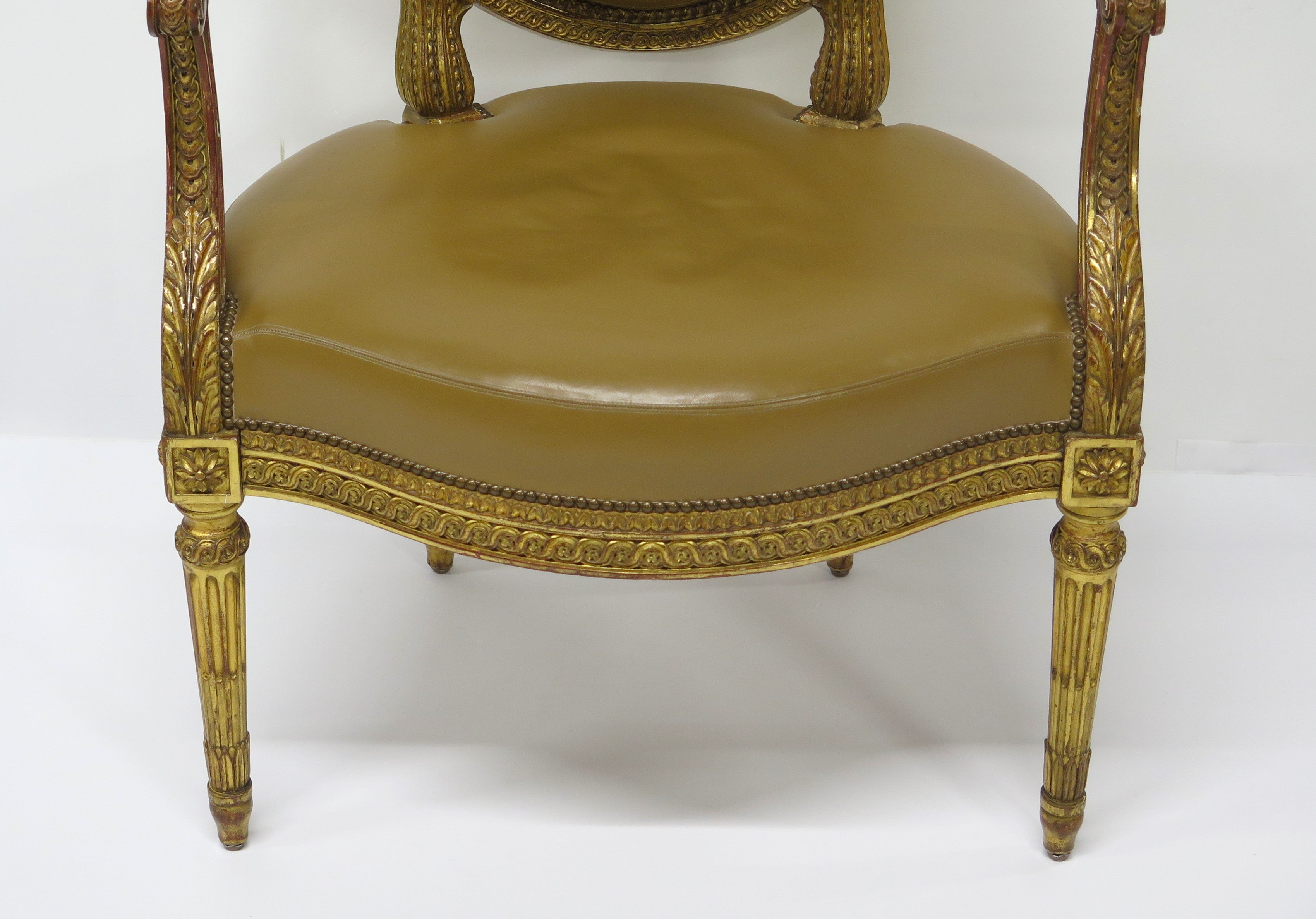 Louis XVI-Style Carved and Gilded Leather Fauteuil