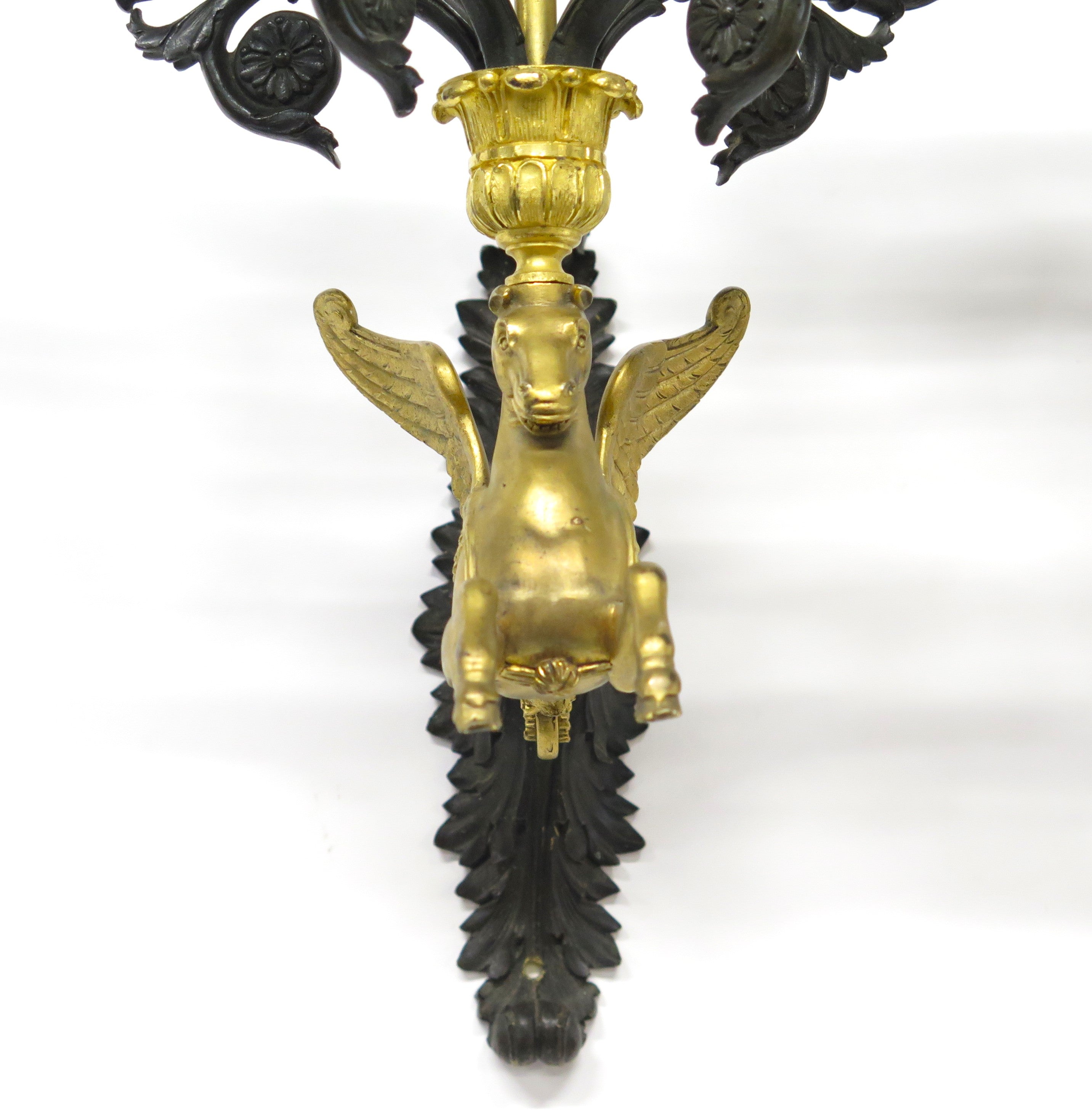 A Pair of Charles X Pattinated and Gilt Five Arm Wall Lights