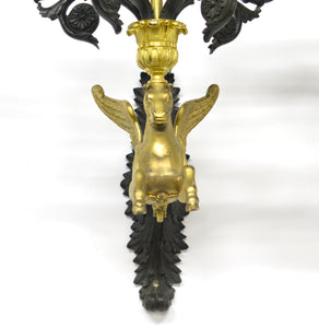 A Pair of Charles X Pattinated and Gilt Five Arm Wall Lights