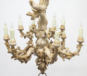 A Carved Italian Faux Bois Pickled Ten Light Chandelier