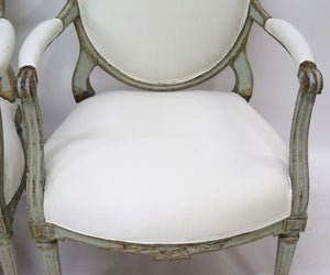 A Pair of 18th Century Paint and Parcel Gilt Italian Arm Chairs