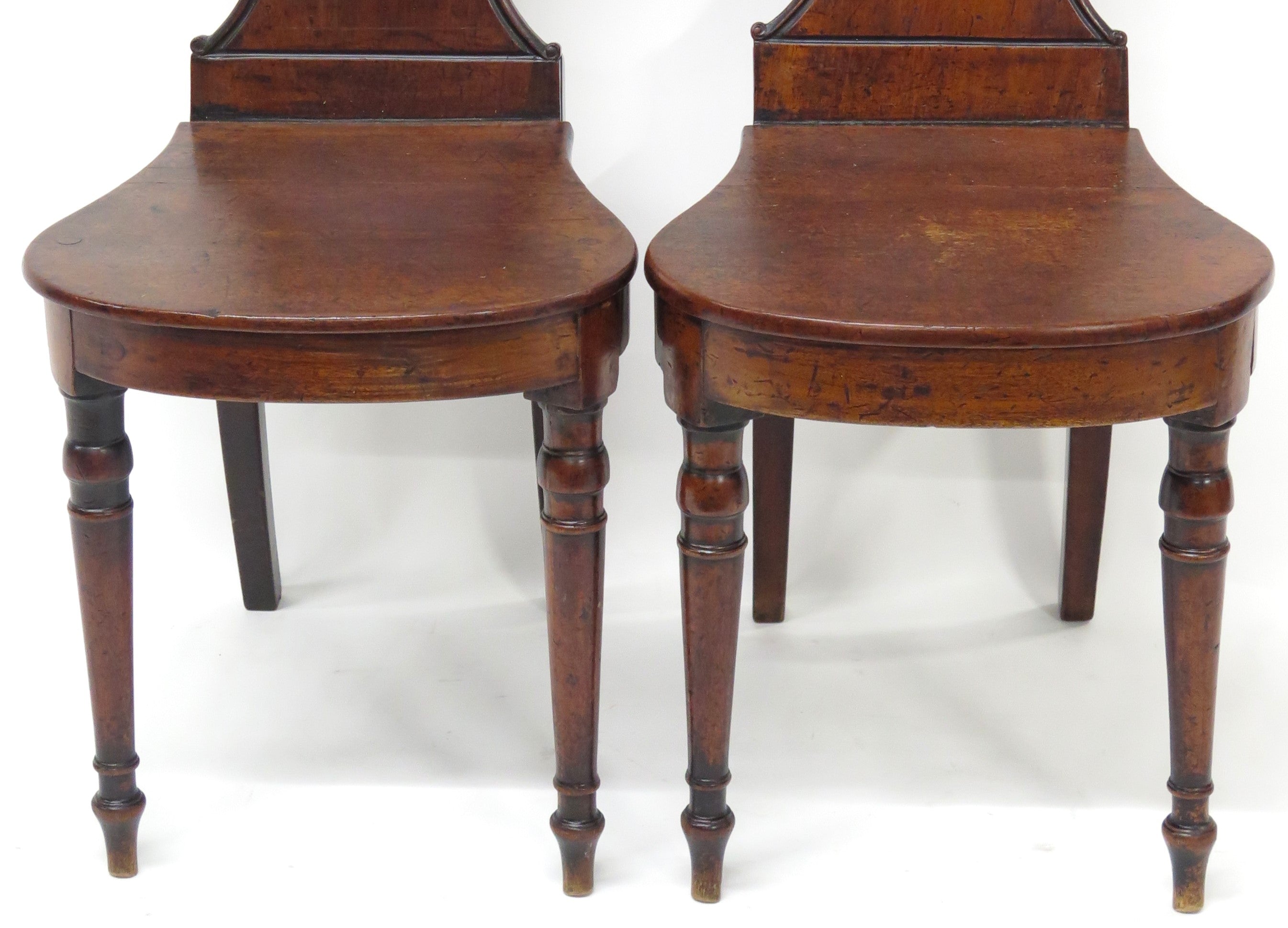 A Pair of English Regency Mahogany Hall Chairs