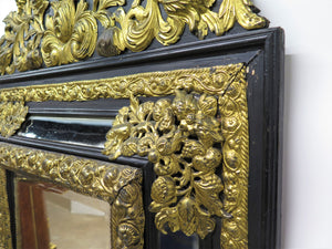 Dutch Looking Glass of Ebony and Brass Repoussé