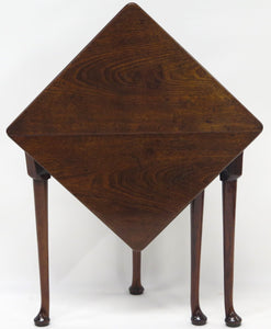 A George III mahogany drop leaf corner table