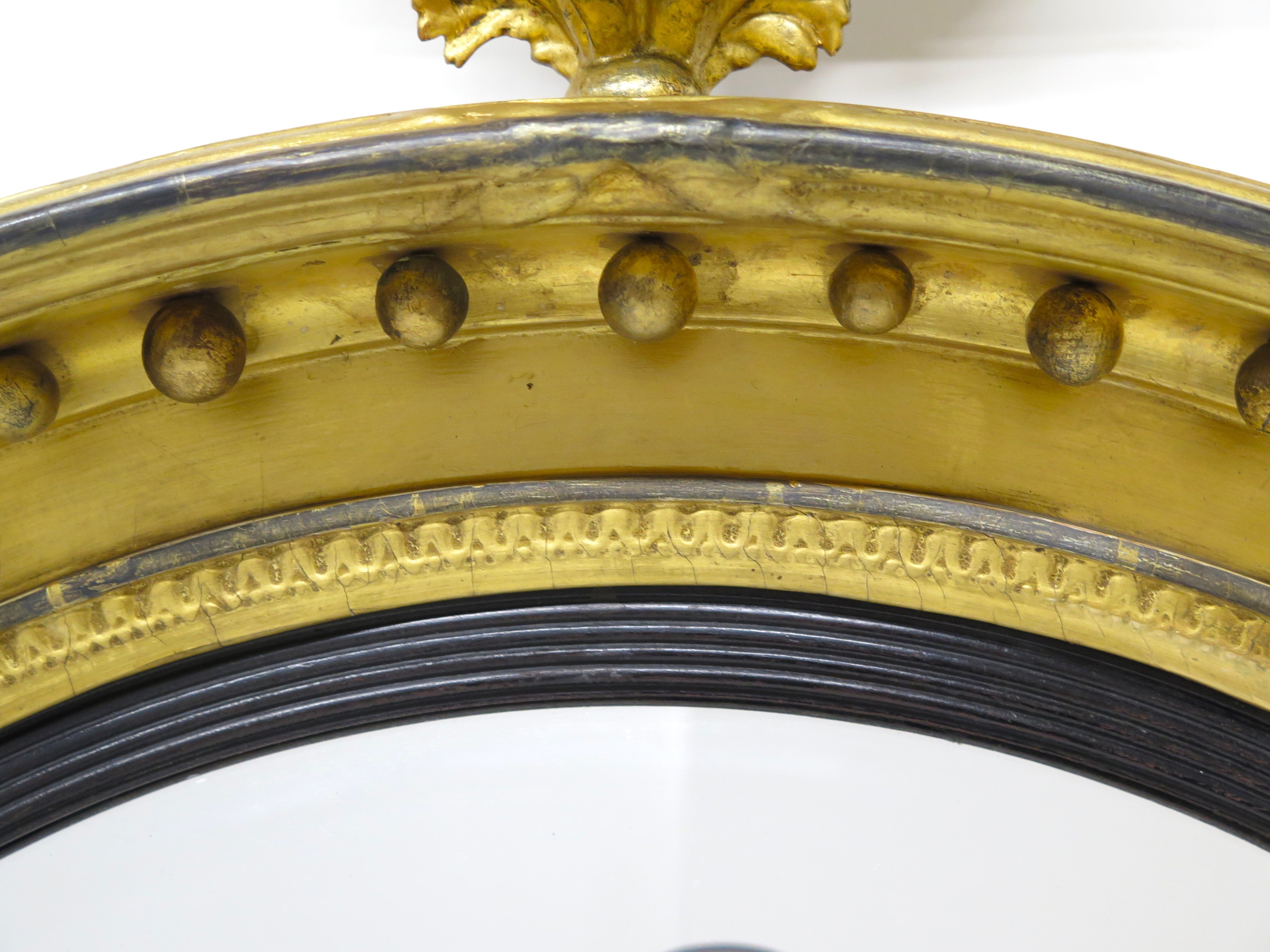 A Large English Regency Gilt Wood Convex Mirror