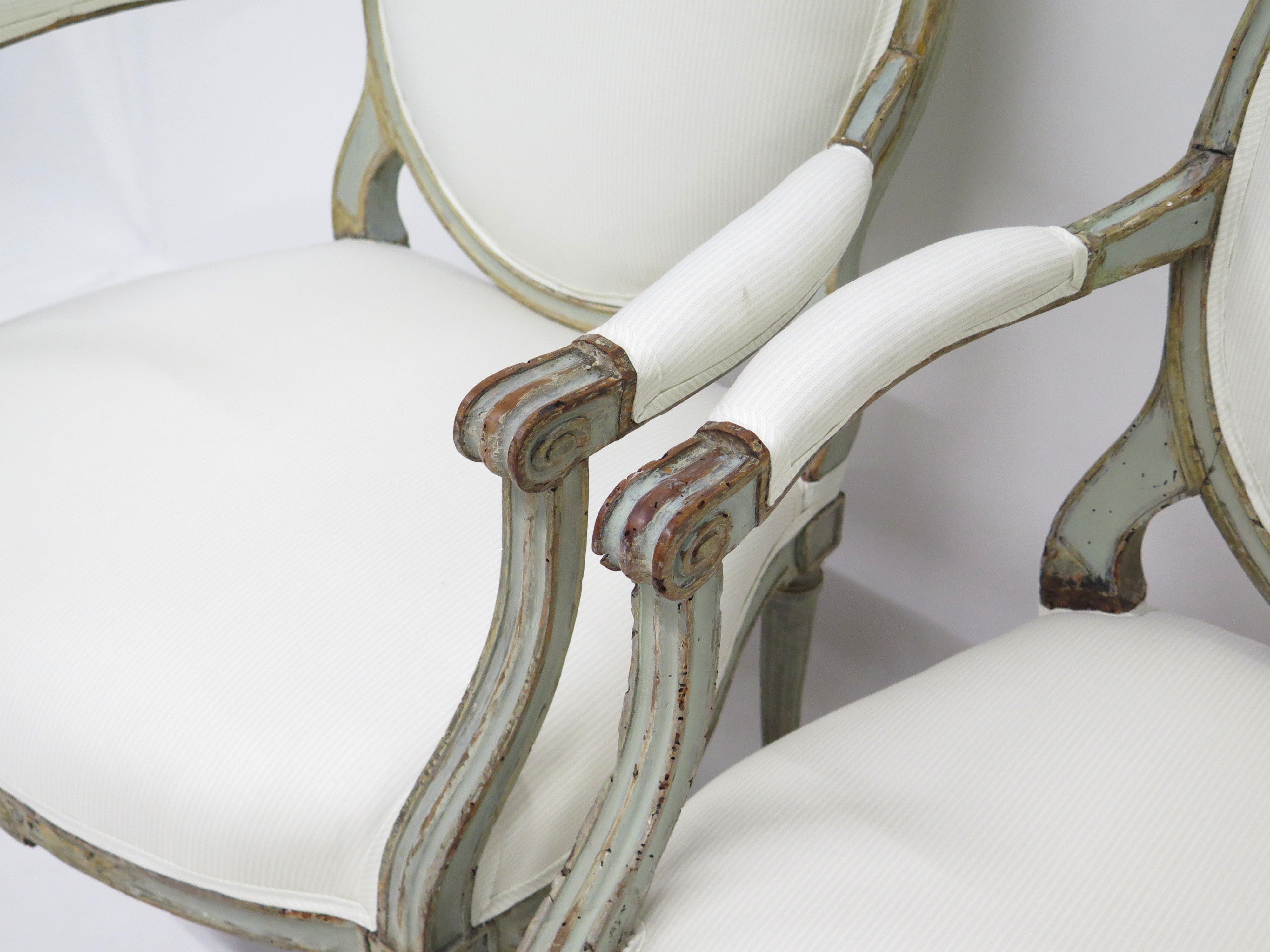 A Pair of 18th Century Paint and Parcel Gilt Italian Arm Chairs