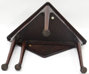 A George III mahogany drop leaf corner table