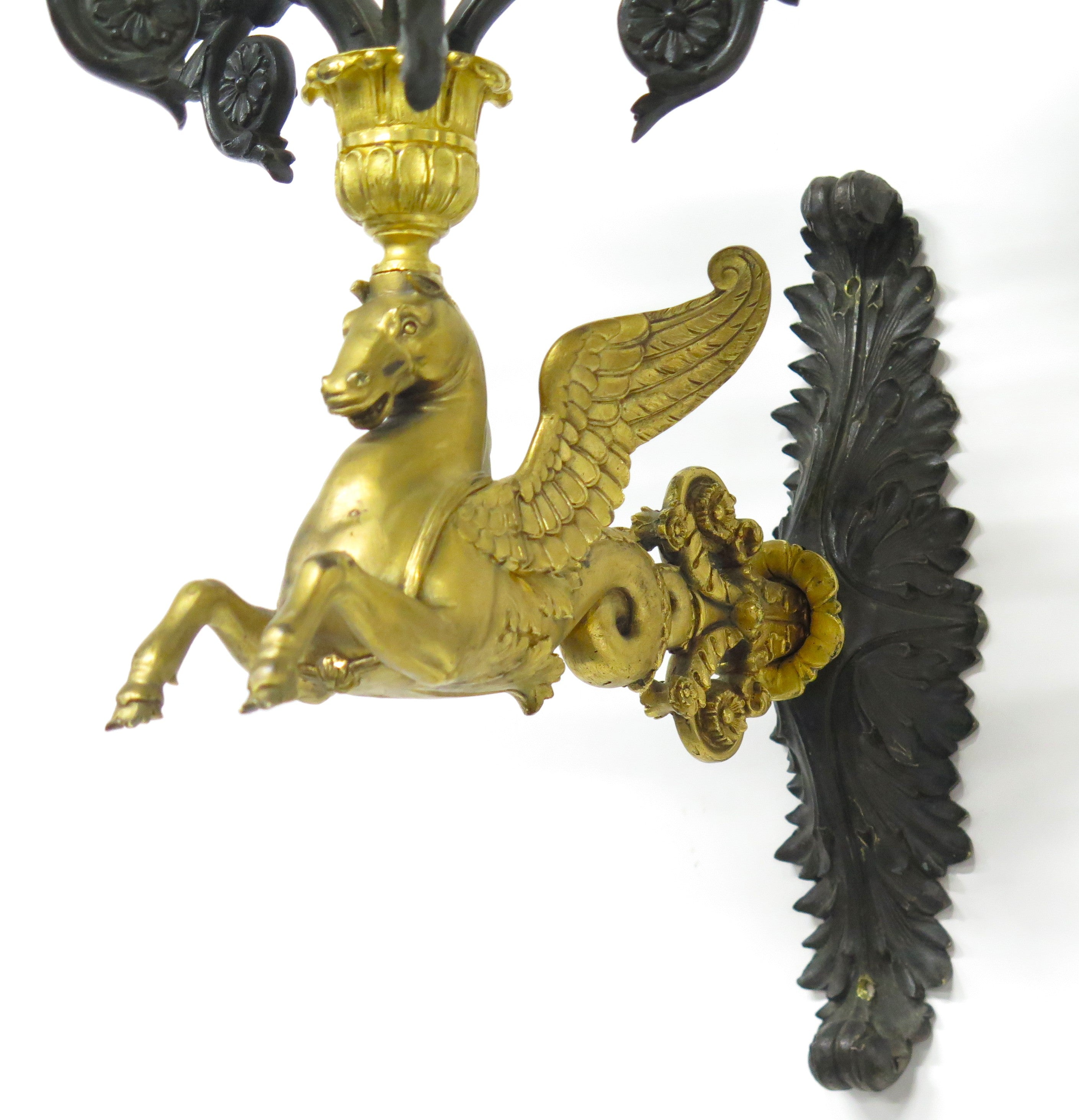 A Pair of Charles X Pattinated and Gilt Five Arm Wall Lights