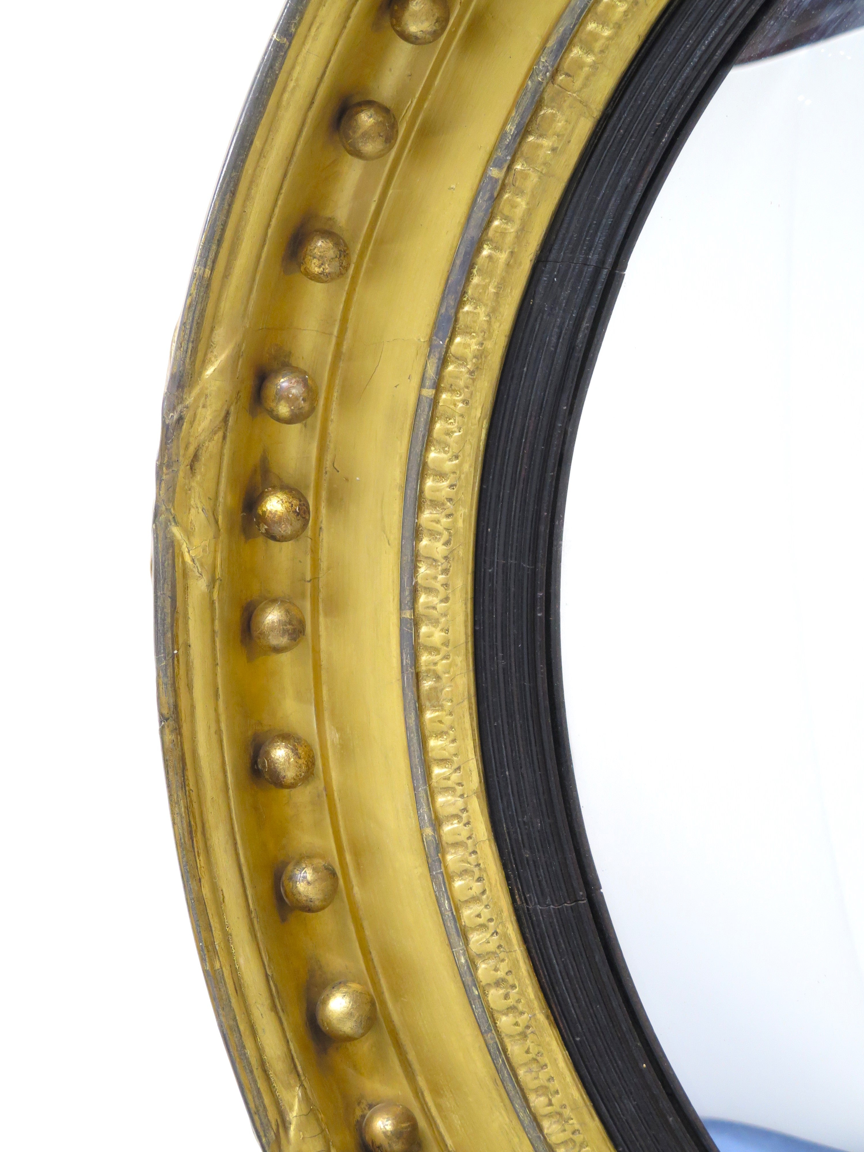 A Large English Regency Gilt Wood Convex Mirror