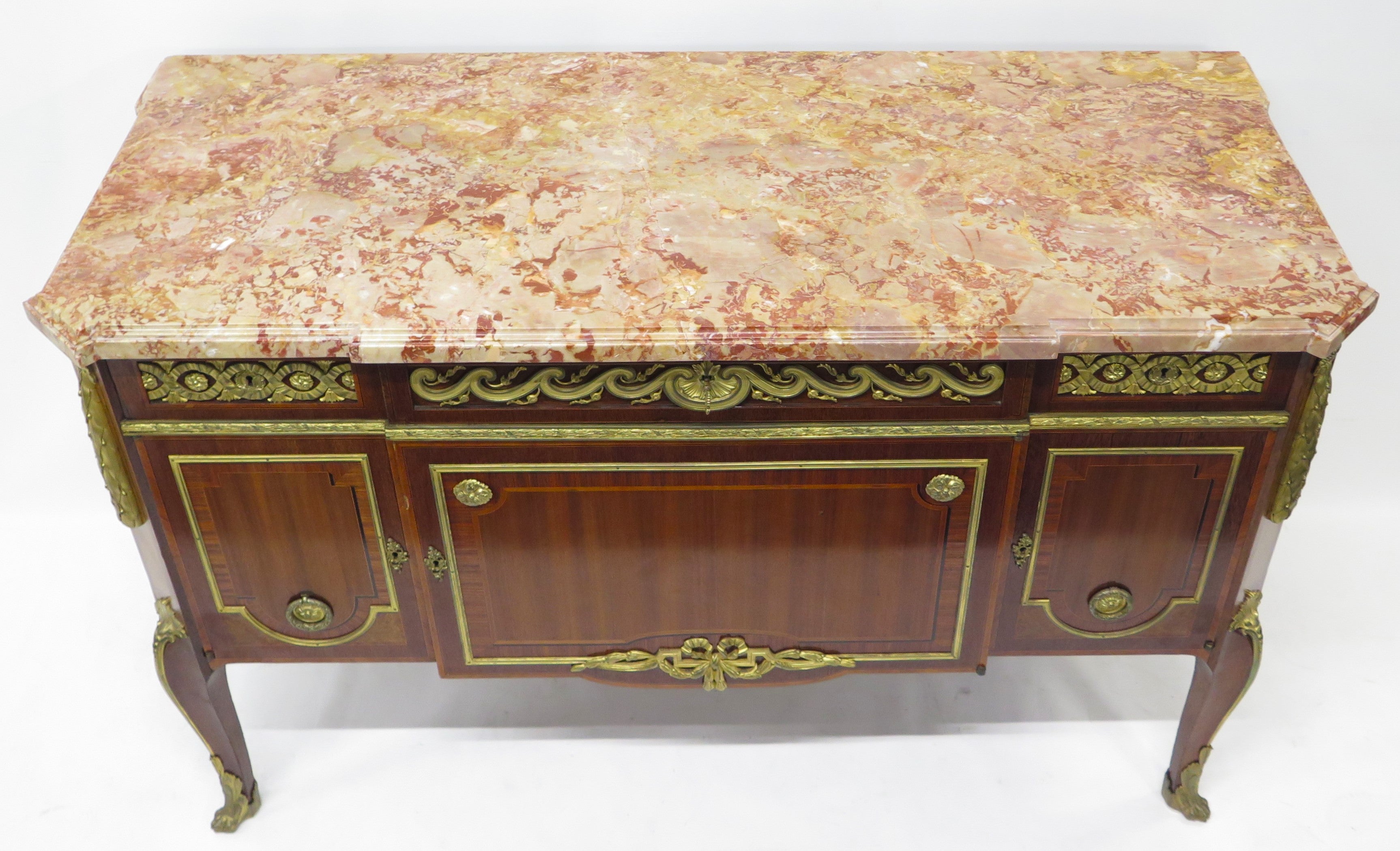 A French Ormolu-mounted Amaranth, Kingwood, Bois Satine, and Burr-amboyna Commode