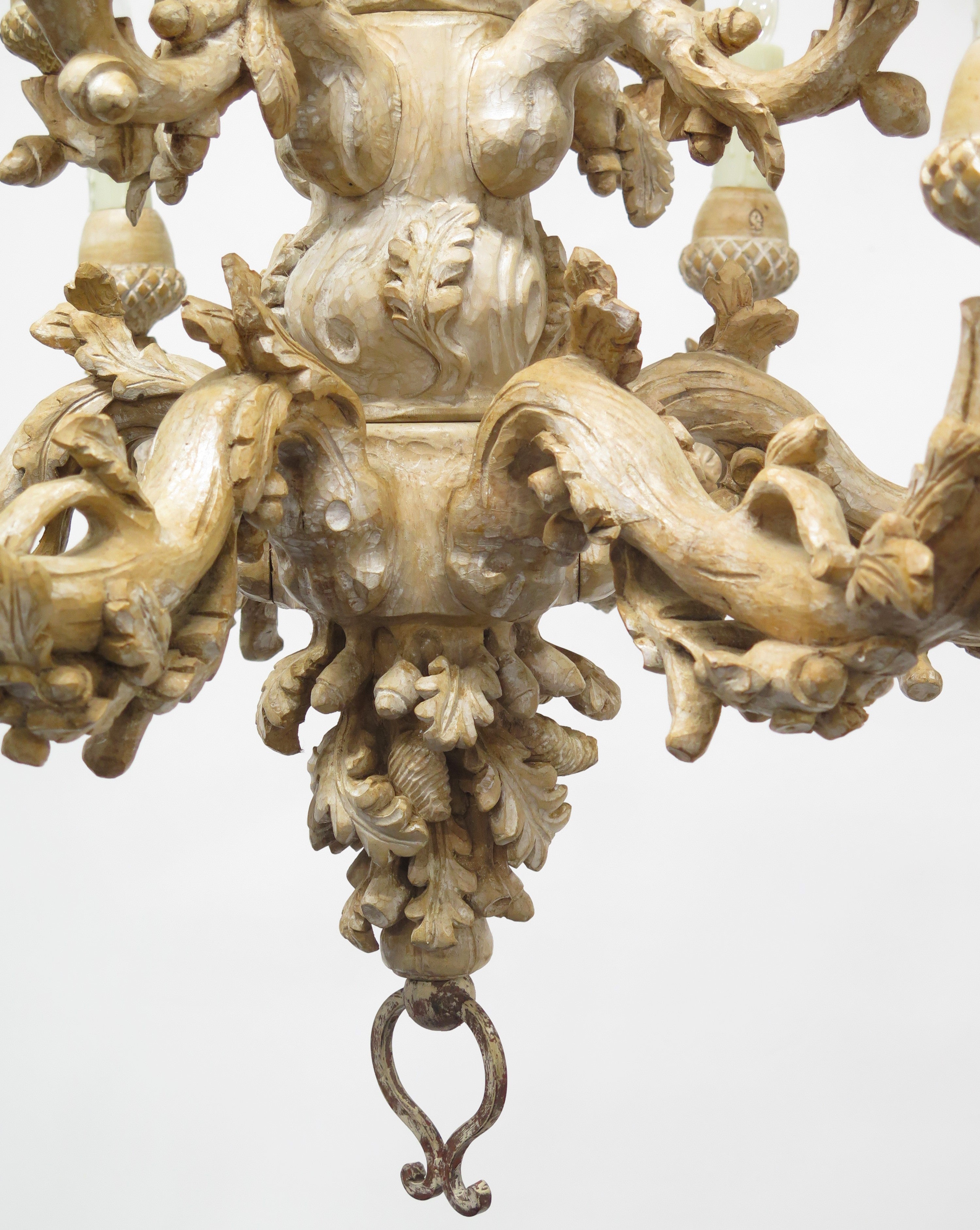 A Carved Italian Faux Bois Pickled Ten Light Chandelier