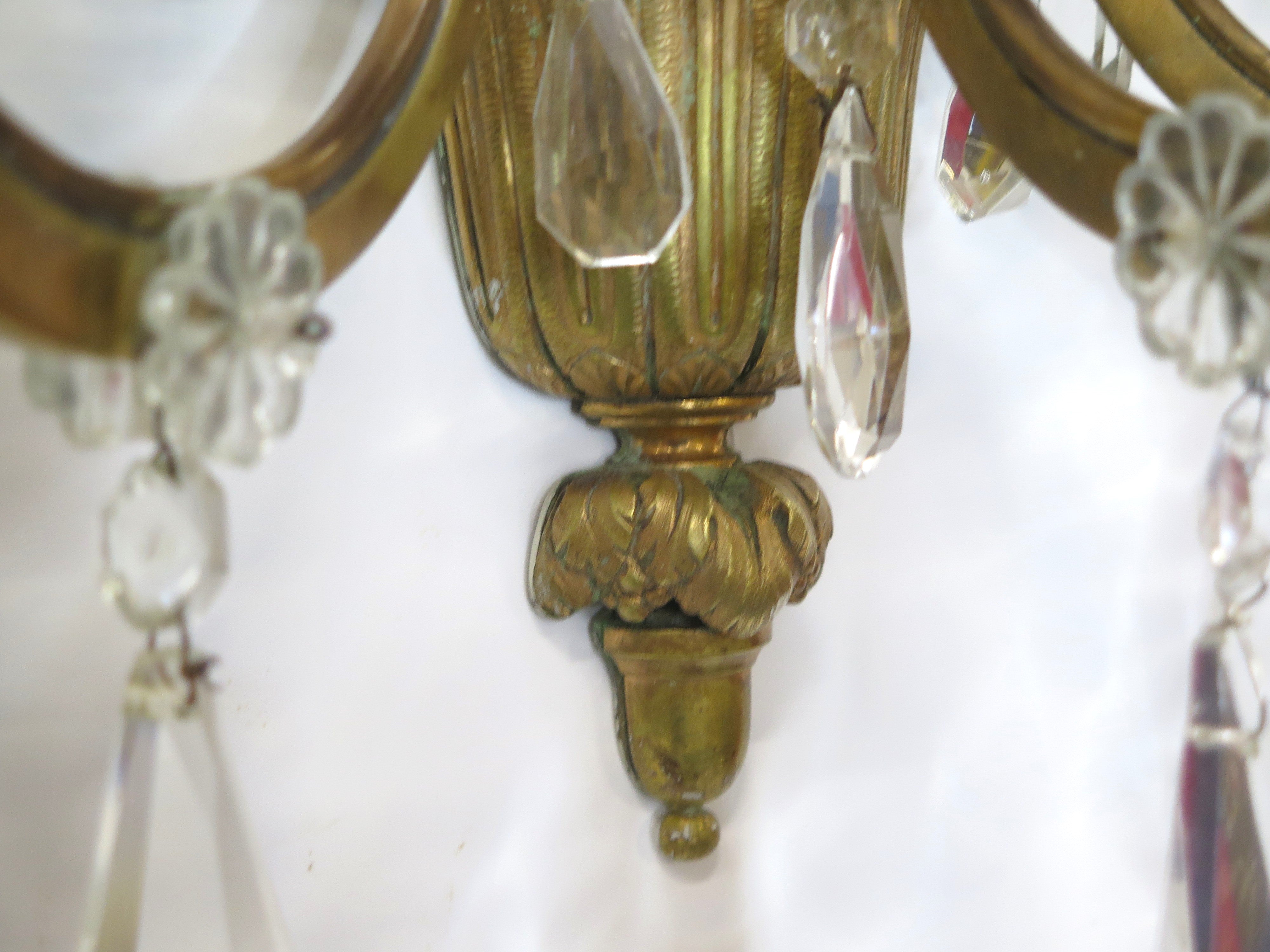 A Pair of Maison Jansen Three Light Bronze and Crystal Sconces