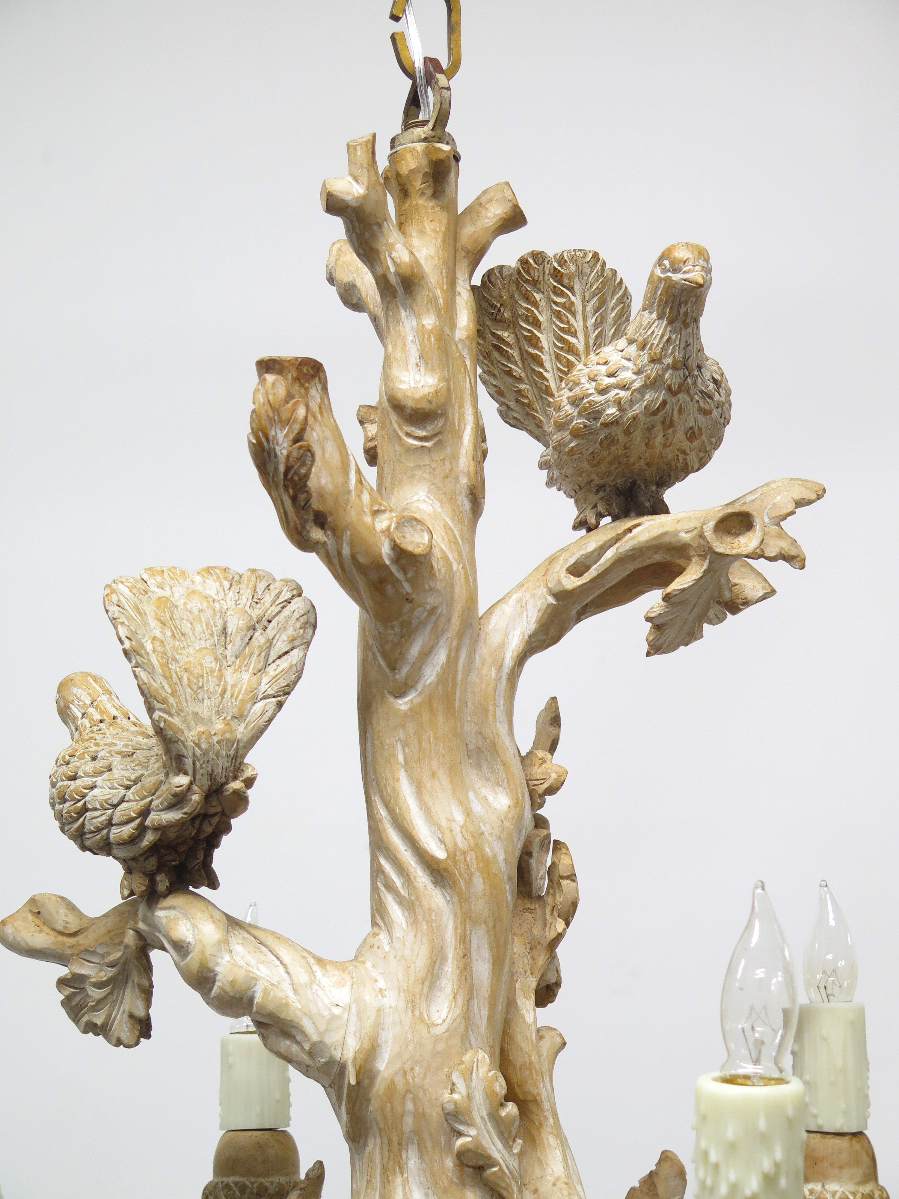 A Carved Italian Faux Bois Pickled Ten Light Chandelier
