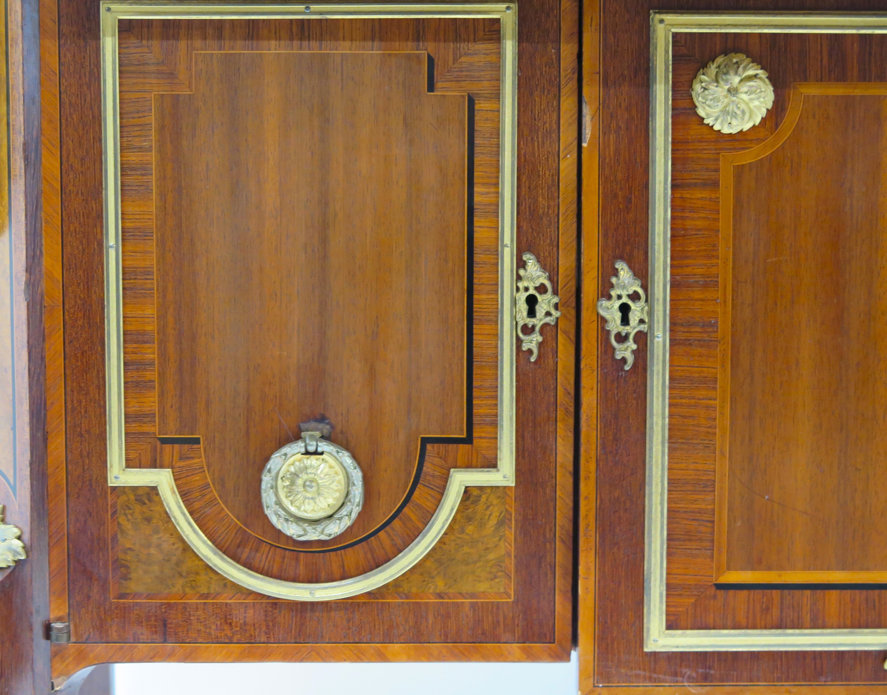 A French Ormolu-mounted Amaranth, Kingwood, Bois Satine, and Burr-amboyna Commode