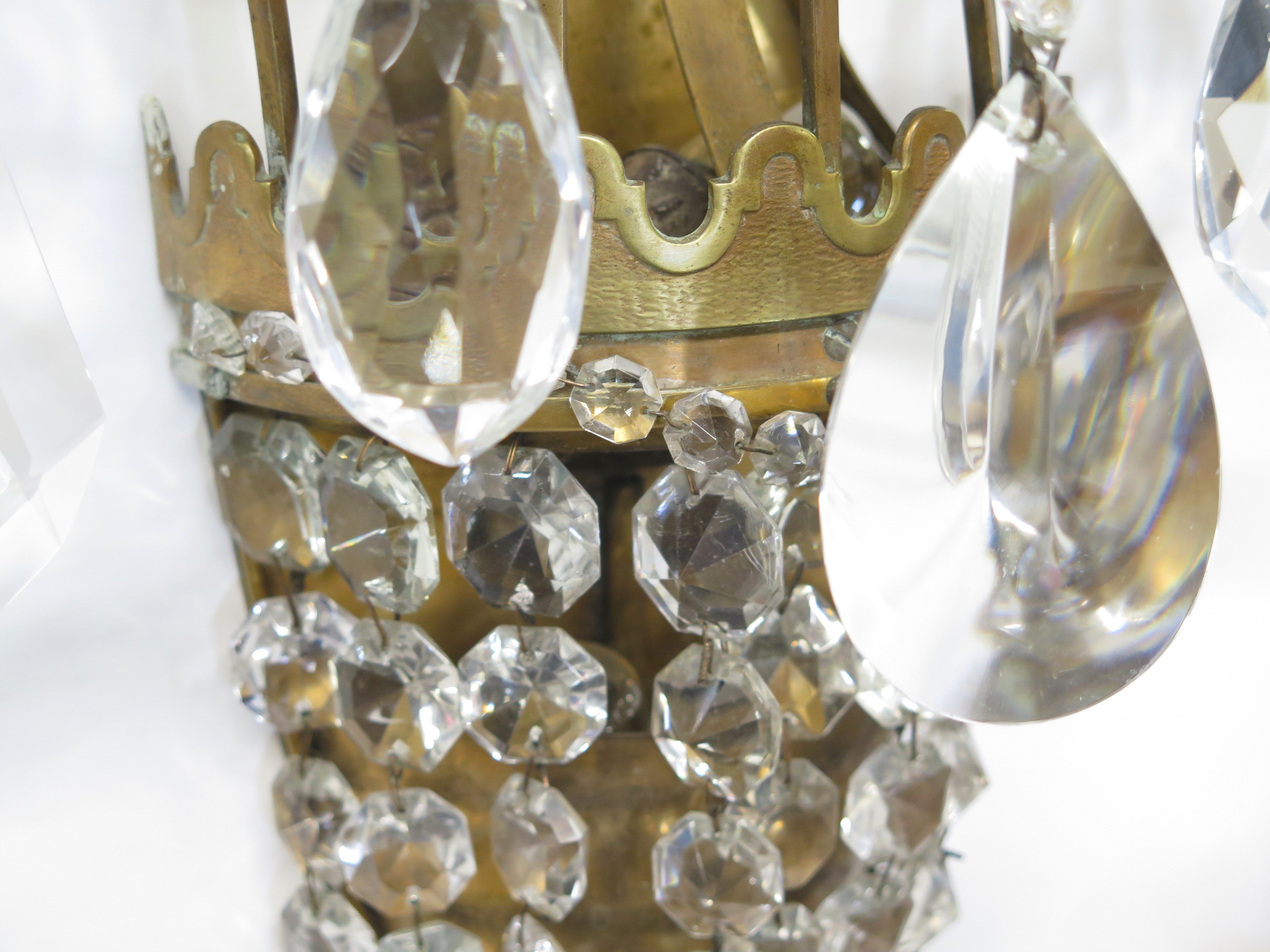 A Pair of Maison Jansen Three Light Bronze and Crystal Sconces
