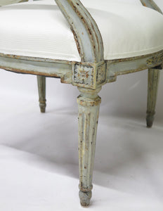 A Pair of 18th Century Paint and Parcel Gilt Italian Arm Chairs