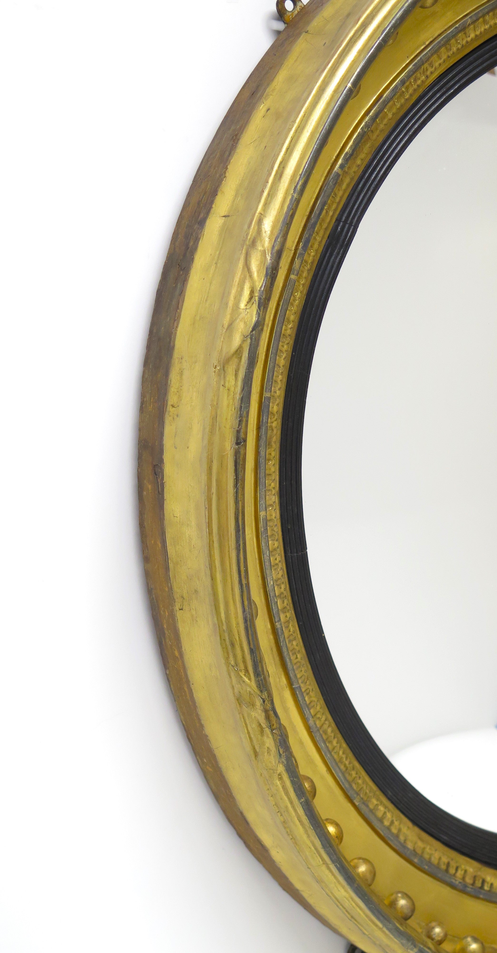 A Large English Regency Gilt Wood Convex Mirror