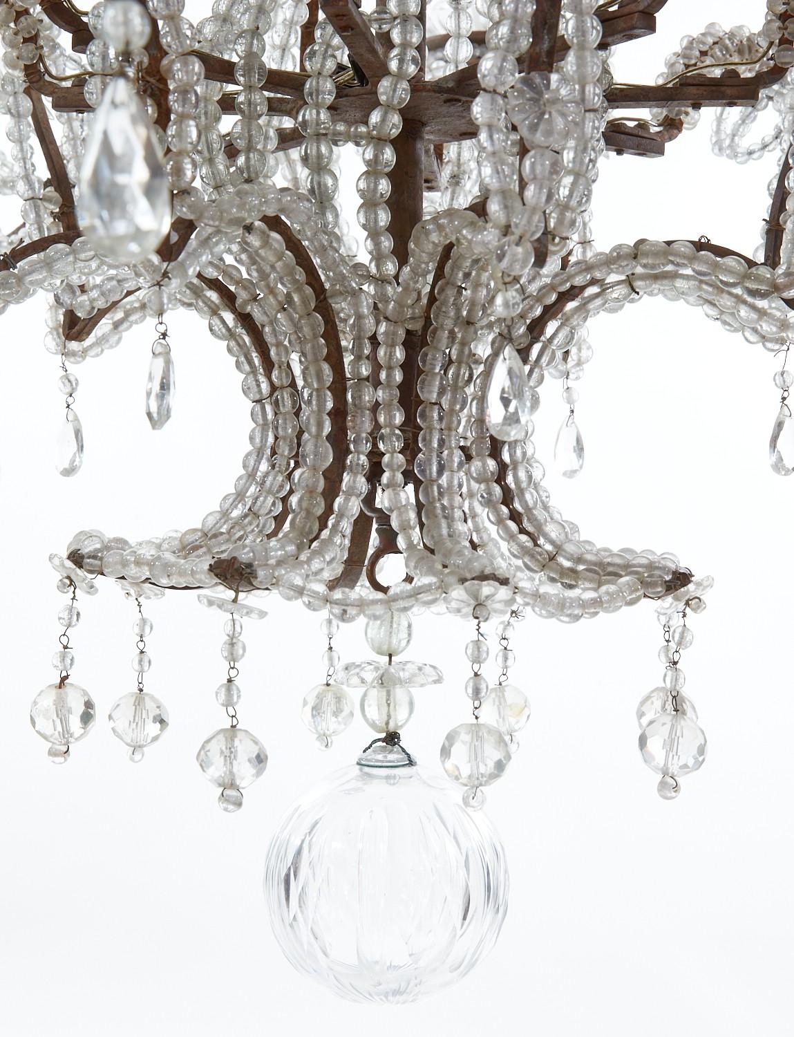 Italian Baroque Style Iron, Cut And Beaded Glass Eight Light Chandelier