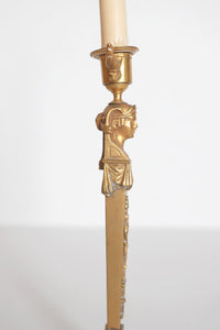 A Pair of Regency Gilt Bronze Candlesticks in the Egyptian Taste