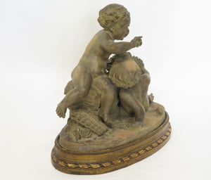 Terracotta Putti Statue Resting on Conforming Raised oval Base Signed " R. Rod "