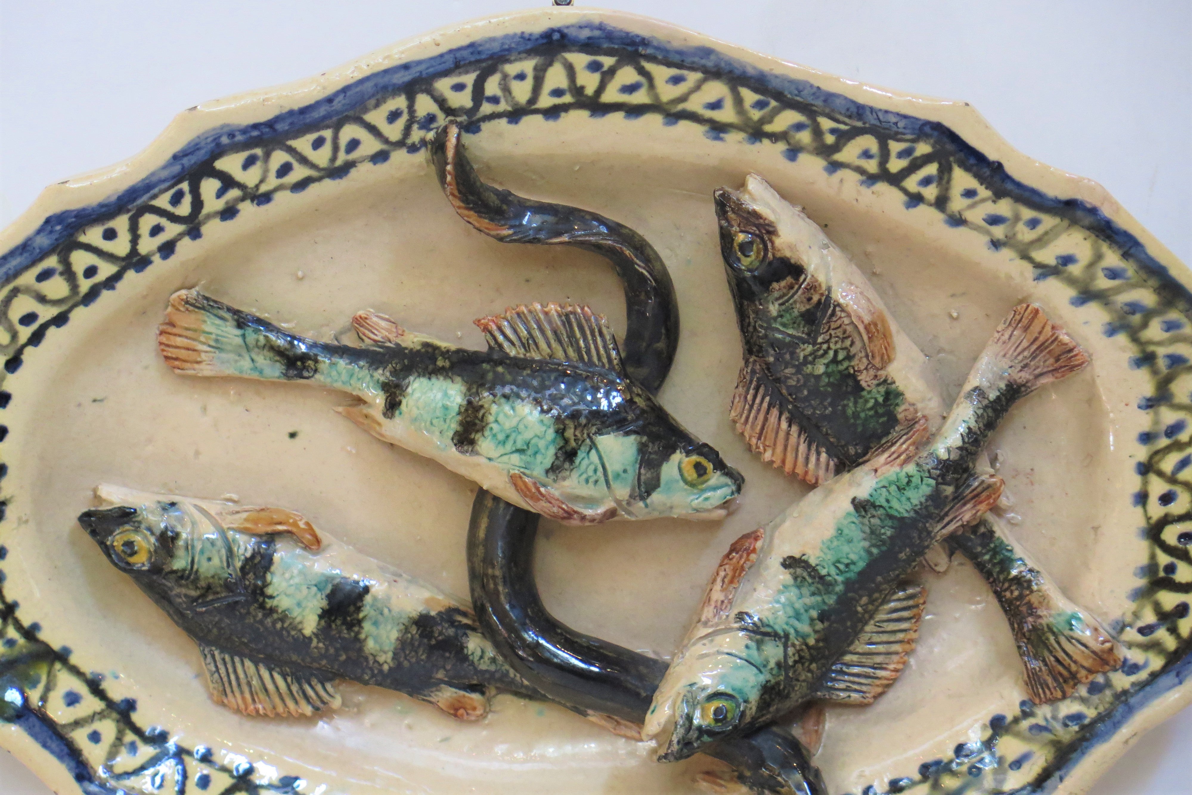 "School of Tours" French Faience Plate with Four Fish and an Eel
