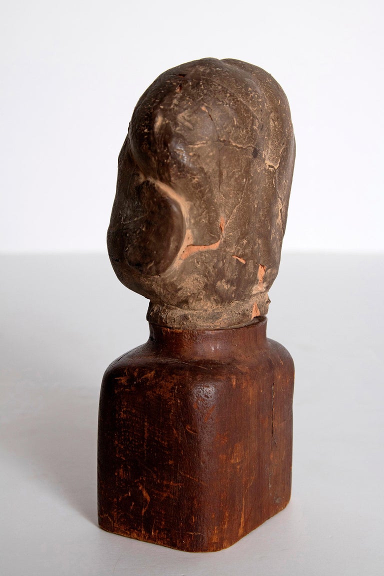 Asian Antiquity Clay Head on Wood Base