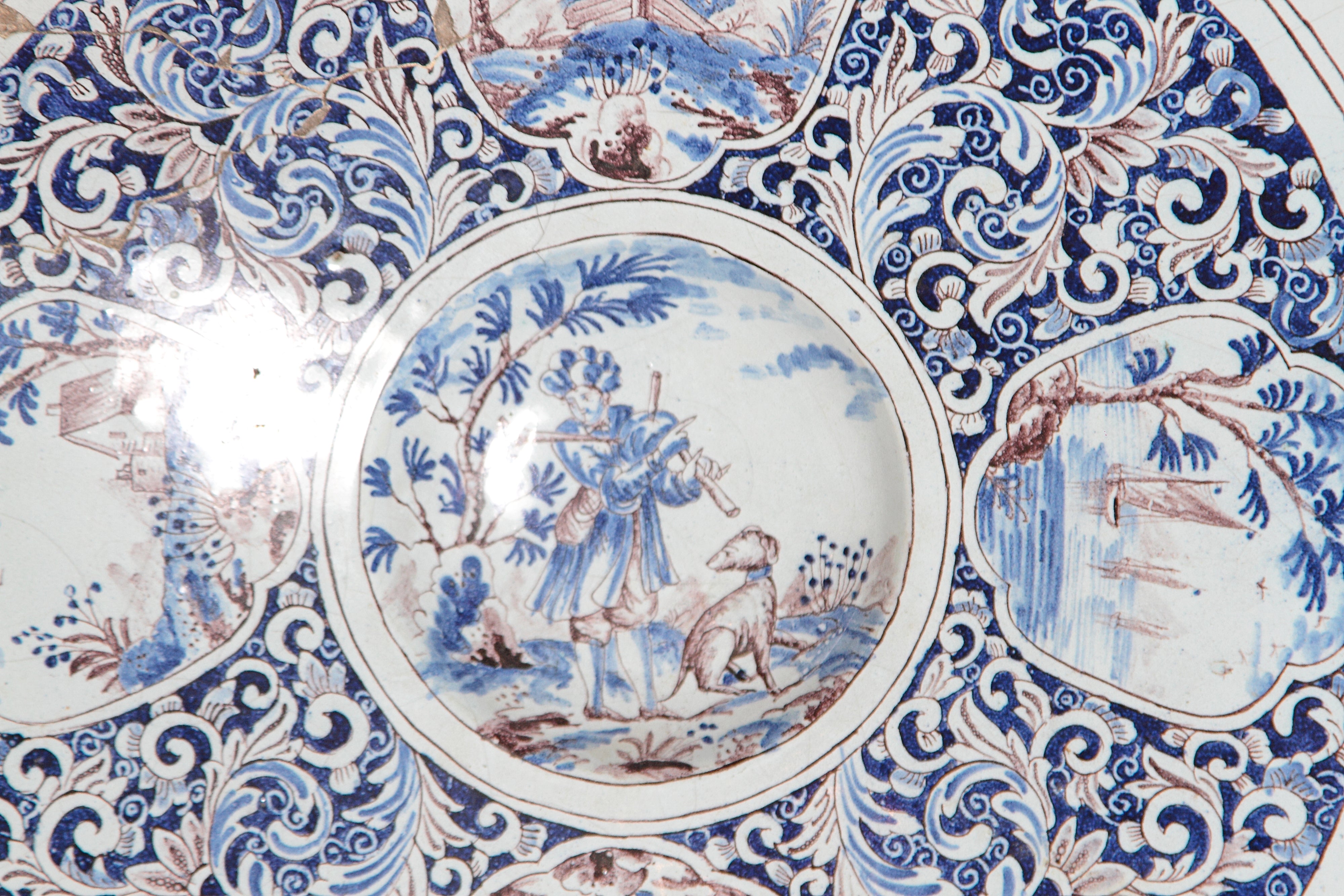 A Large 18th Century Delft Faience Charger with Floral Cartouches