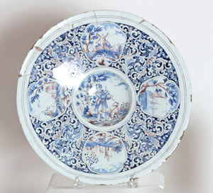 A Large 18th Century Delft Faience Charger with Floral Cartouches